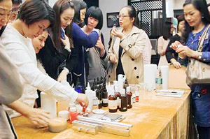 Students making aromatherapy products during the ground floor workshop